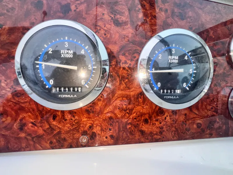 Slide: The Image of Dashboard of 2005 Formula 330 Sun Sport with dual RPM gauges. - 17