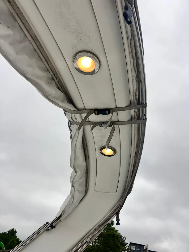 Slide: The Image of 2005 Formula 330 Sun Sport boat canopy with integrated lights, overcast sky background. - 22