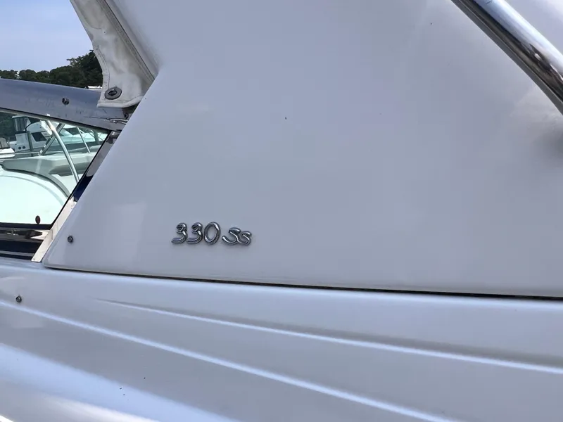 Slide: The Image of 2005 Formula 330 Sun Sport boat with sleek white exterior and chrome "330 SS" emblem. - 28