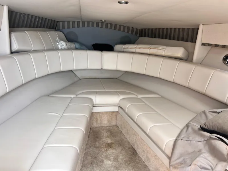 Slide: The Image of 2005 Formula 330 Sun Sport cabin interior with white leather seating. - 29