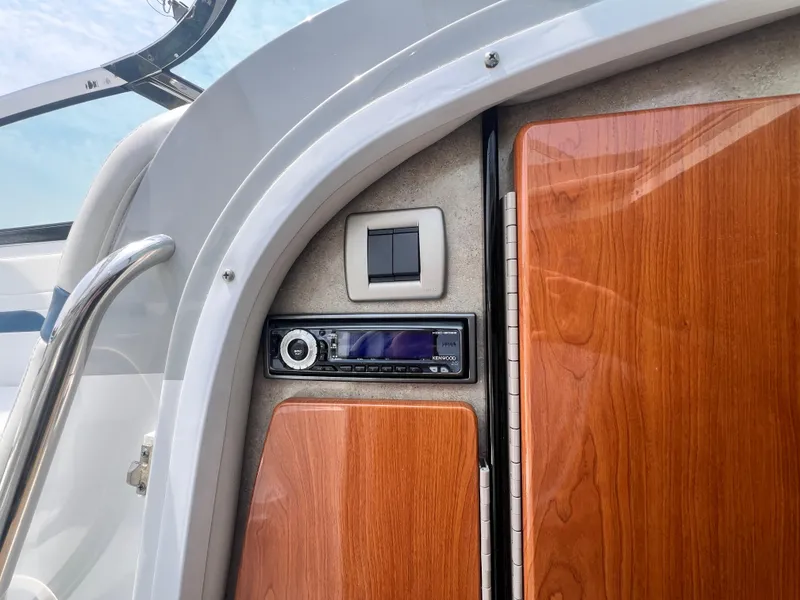 Slide: The Image of 2005 Formula 330 Sun Sport interior with Kenwood stereo and wooden cabinetry. - 32