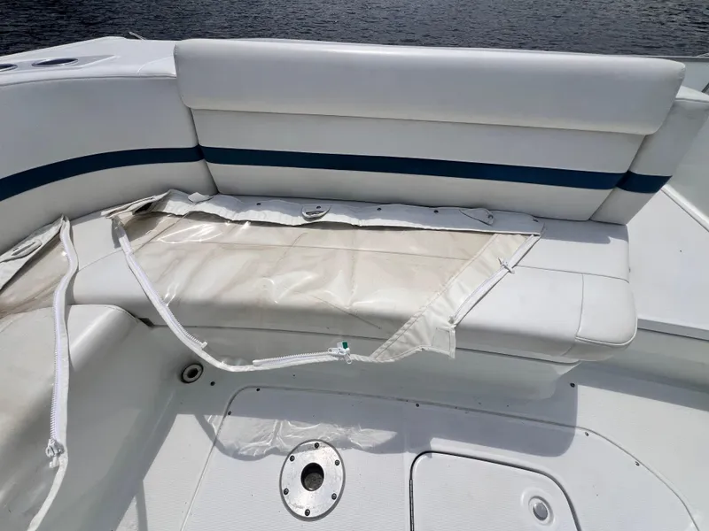Slide: The Image of 2005 Formula 330 Sun Sport boat seating with damaged upholstery and exposed zipper. - 37