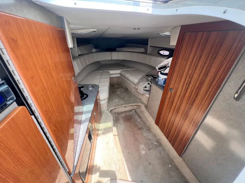 Slide: The Image of Interior of 2005 Formula 330 Sun Sport boat with wood cabinetry and seating area. - 38
