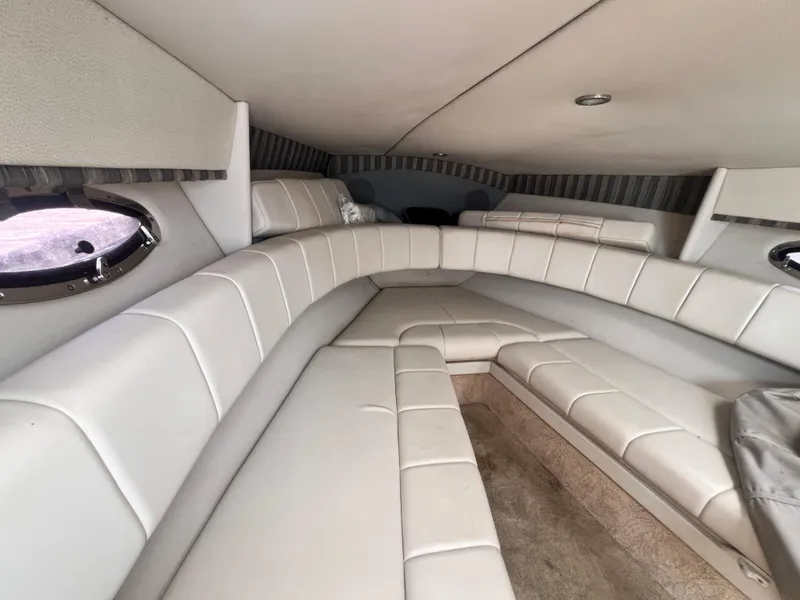 Slide: The Image of Interior of 2005 Formula 330 Sun Sport boat with white leather seating. - 40