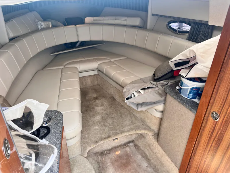 Slide: The Image of Interior cabin of a 2005 Formula 330 Sun Sport boat with beige seating. - 49