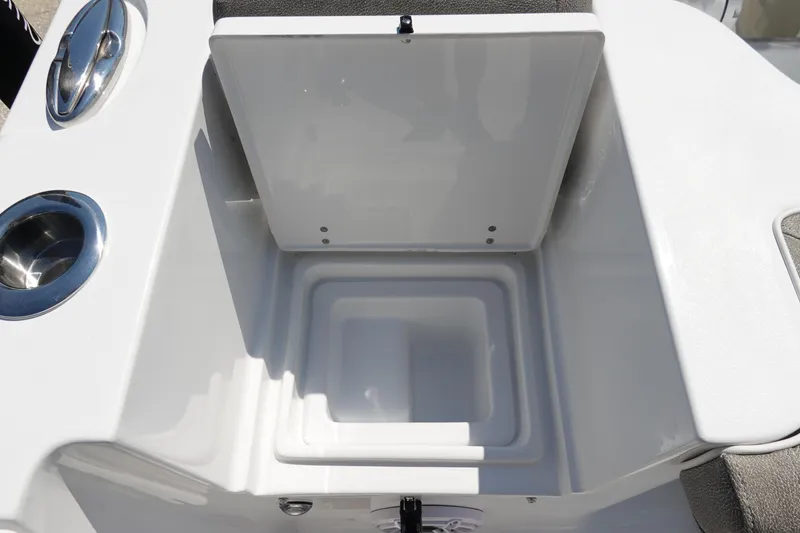 Slide: The Image of 2026 Sea Hunt Gamefish 27 boat storage compartment with stainless steel cup holder. - 12