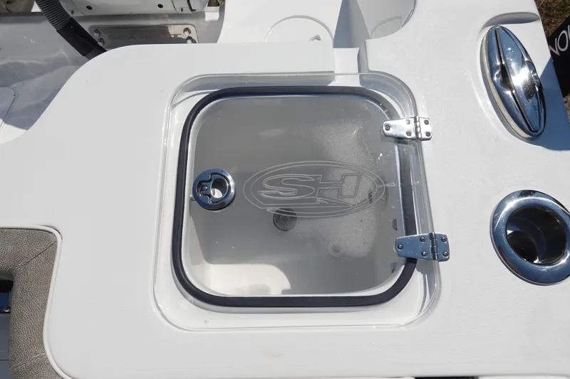 Slide: The Image of Livewell on 2026 Sea Hunt Gamefish 27 boat, featuring a clear lid and chrome fittings. - 13