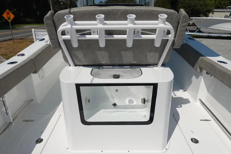 Slide: The Image of 2026 Sea Hunt Gamefish 27 boat interior with rod holders and livewell. - 15