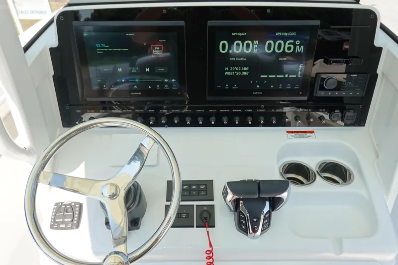 Slide: The Image of Control panel of 2026 Sea Hunt Gamefish 27 boat with advanced navigation displays. - 18