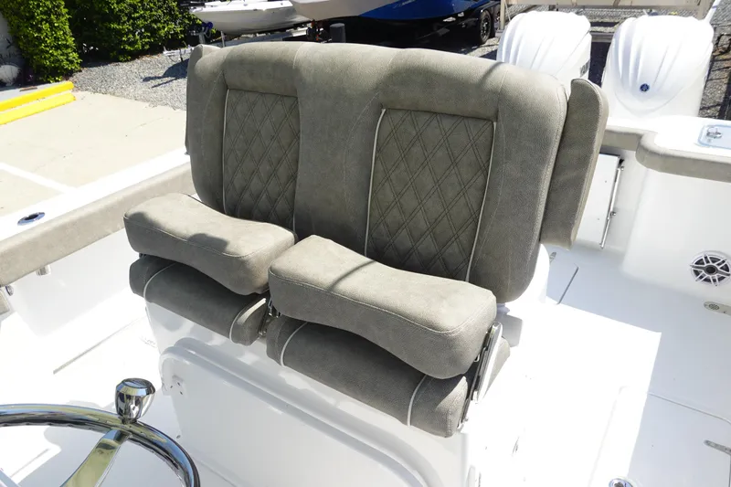 Slide: The Image of 2026 Sea Hunt Gamefish 27 boat seating with diamond-stitched upholstery and armrests. - 20