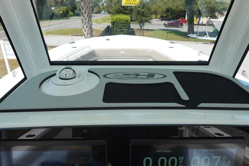 Slide: The Image of 2026 Sea Hunt Gamefish 27 dashboard with compass and digital displays. - 22