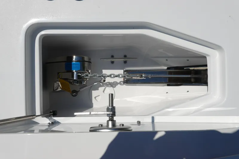 Slide: The Image of Anchor compartment of 2026 Sea Hunt Gamefish 27 boat, featuring stainless steel components. - 30