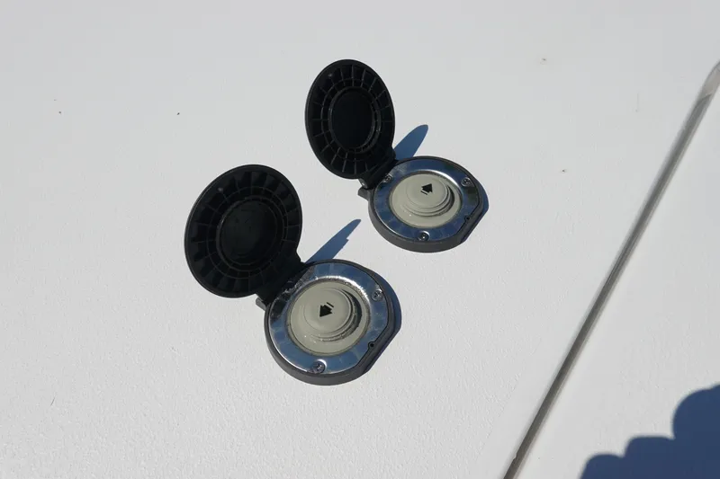 Slide: The Image of Fuel caps on a 2026 Sea Hunt Gamefish 27 boat deck. - 31