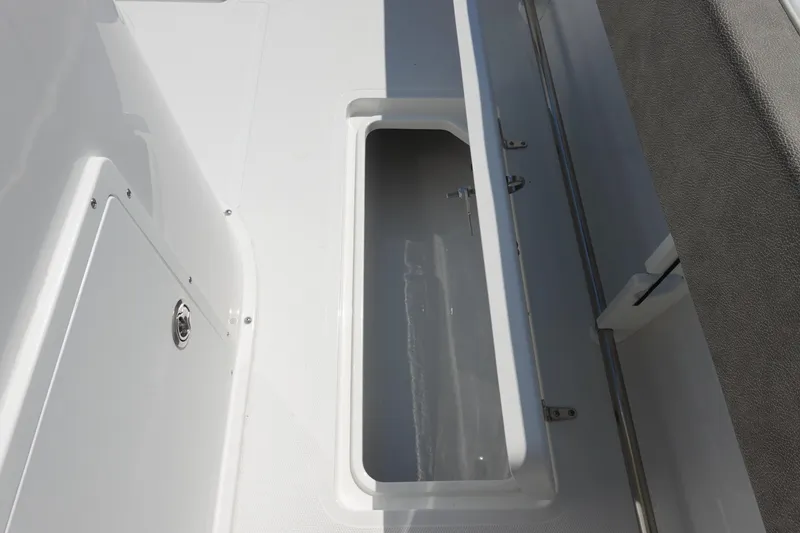 Slide: The Image of Open storage compartment on 2026 Sea Hunt Gamefish 27 boat deck. - 35