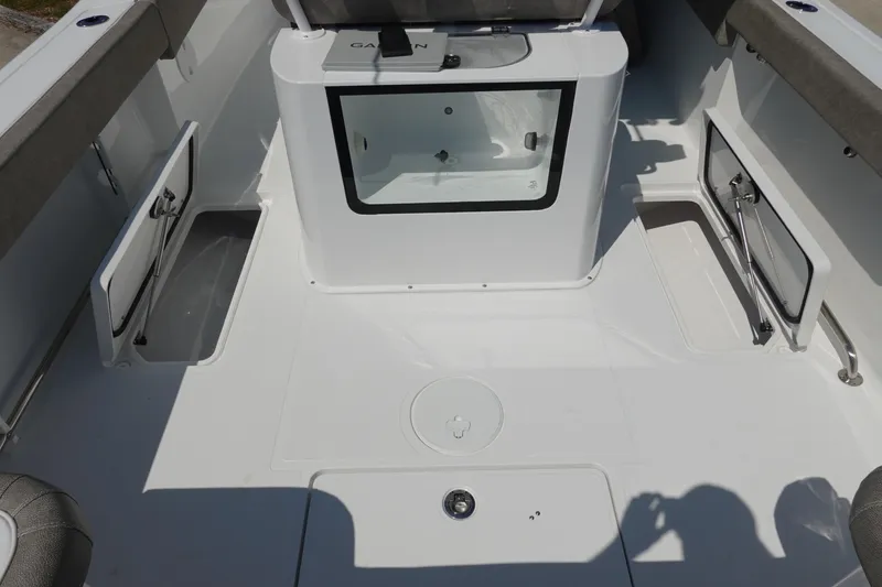 Slide: The Image of 2026 Sea Hunt Gamefish 27 boat interior with storage compartments and seating. - 36