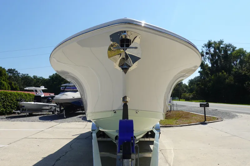 Slide: The Image of 2026 Sea Hunt Gamefish 27 boat on trailer, front view, sunny day. - 4