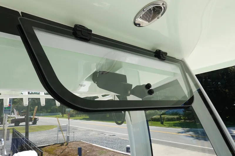 Slide: The Image of 2026 Sea Hunt Gamefish 27 boat window detail with open hatch and exterior view. - 40