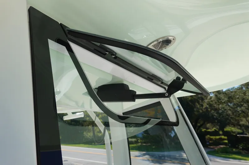 Slide: The Image of 2026 Sea Hunt Gamefish 27 boat windshield detail with open vent window. - 41