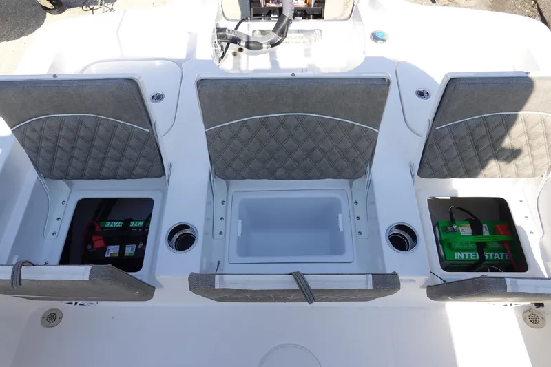 Slide: The Image of 2026 Sea Hunt BX 25 FS boat interior with storage compartments and batteries. - 11