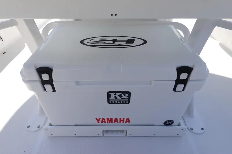 Slide: The Image of White K2 cooler on 2026 Sea Hunt BX 25 FS boat with Yamaha branding. - 13