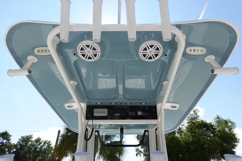 Slide: The Image of 2026 Sea Hunt BX 25 FS boat T-top with speakers and rod holders. - 14