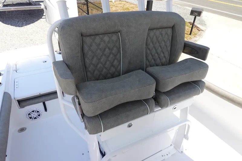 Slide: The Image of 2026 Sea Hunt BX 25 FS boat with comfortable dual gray seats and armrests. - 15