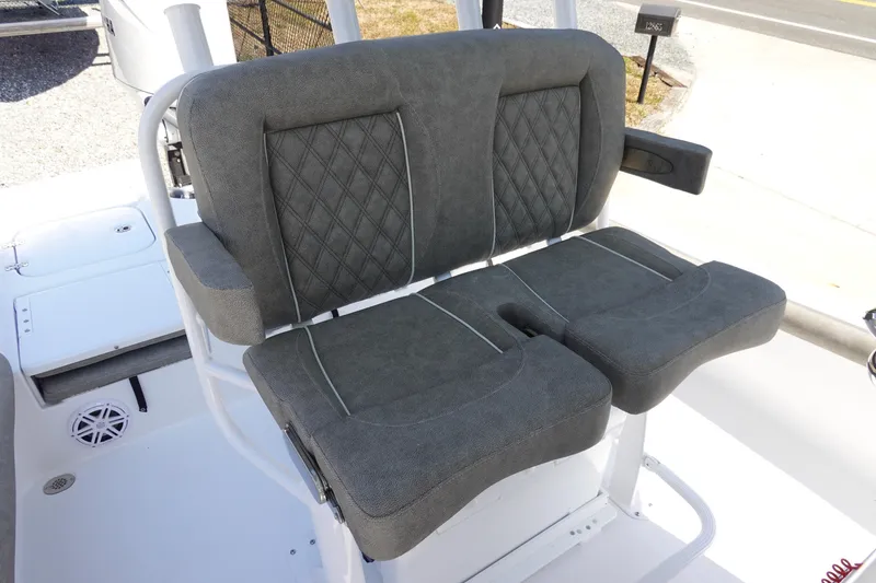 Slide: The Image of 2026 Sea Hunt BX 25 FS boat seating with gray upholstery and diamond stitching. - 16