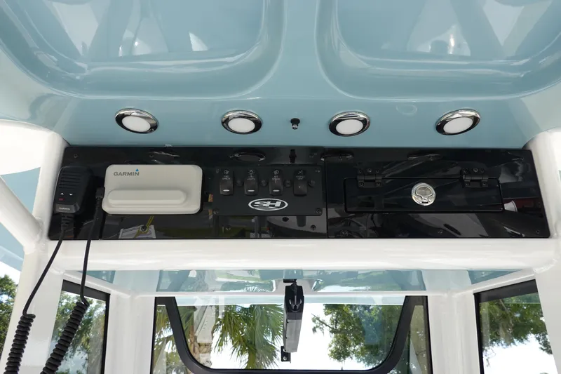 Slide: The Image of 2026 Sea Hunt BX 25 FS boat console with Garmin equipment and control panel. - 19