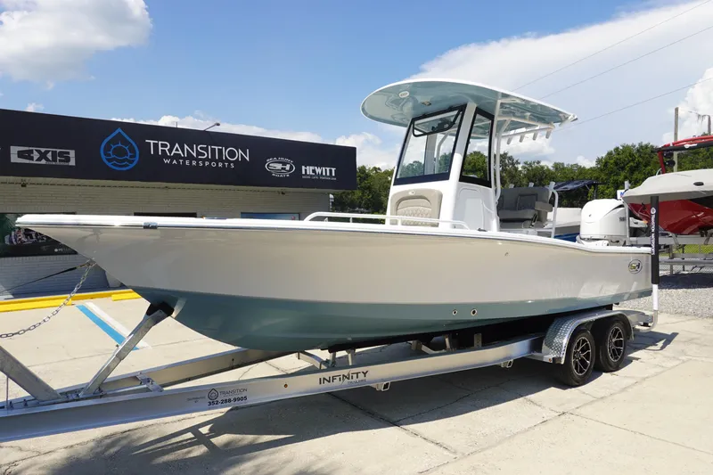 Slide: The Image of 2026 Sea Hunt BX 25 FS boat on trailer at Transition Watersports dealership. - 2