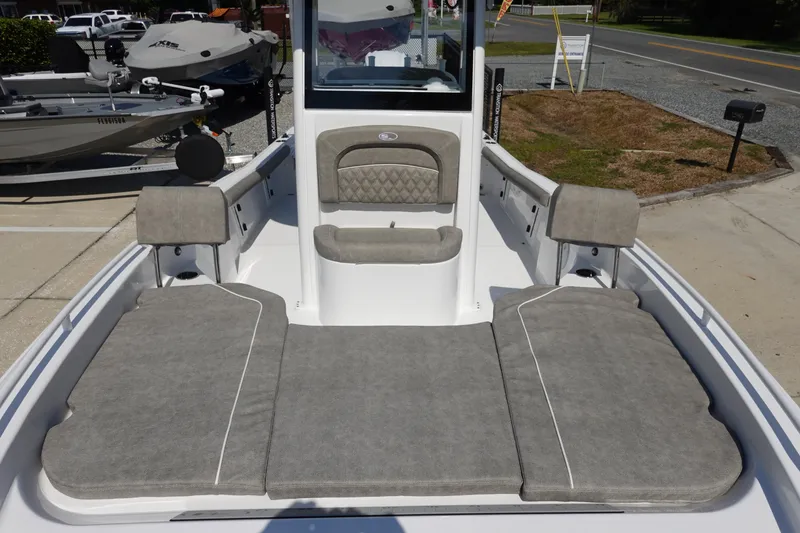 Slide: The Image of 2026 Sea Hunt BX 25 FS boat interior with cushioned seating and spacious deck layout. - 24