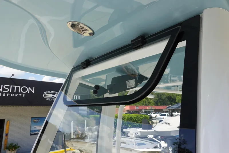 Slide: The Image of 2026 Sea Hunt BX 25 FS boat window detail at dealership. - 32