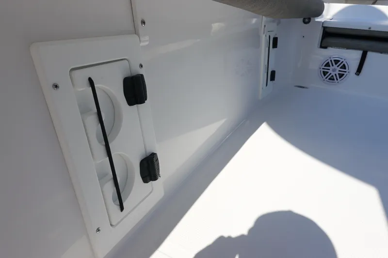 Slide: The Image of 2026 Sea Hunt BX 25 FS boat interior with storage compartment and speaker. - 34
