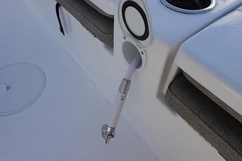 Slide: The Image of 2026 Sea Hunt BX 25 FS boat detail with hose and cup holder. - 35