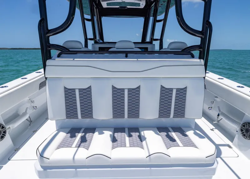 Slide: The Image of 2026 Invincible 38 Catamaran interior with luxurious seating, ocean backdrop. - 30