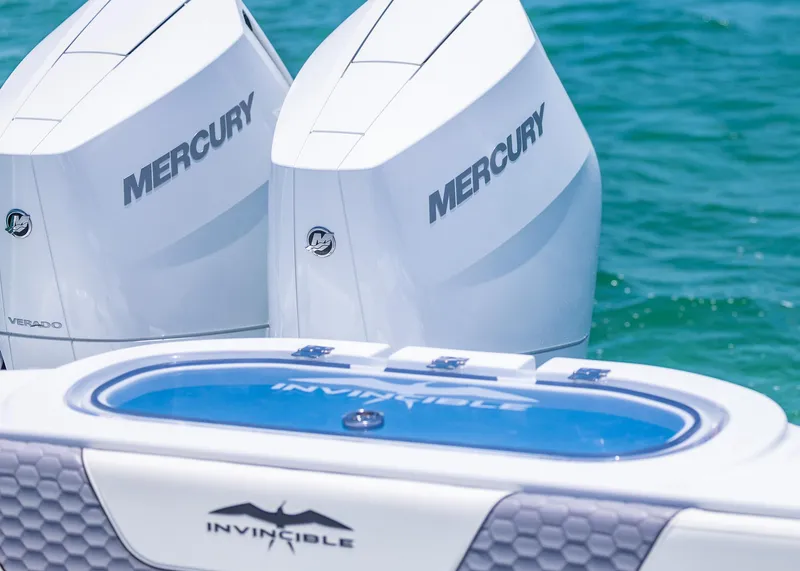 Slide: The Image of 2026 Invincible 38 Catamaran with twin Mercury outboard engines on blue water. - 34