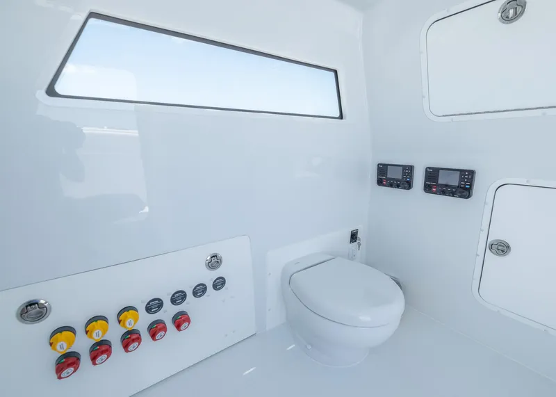 Slide: The Image of 2026 Invincible 38 Catamaran interior with modern controls and marine toilet. - 36