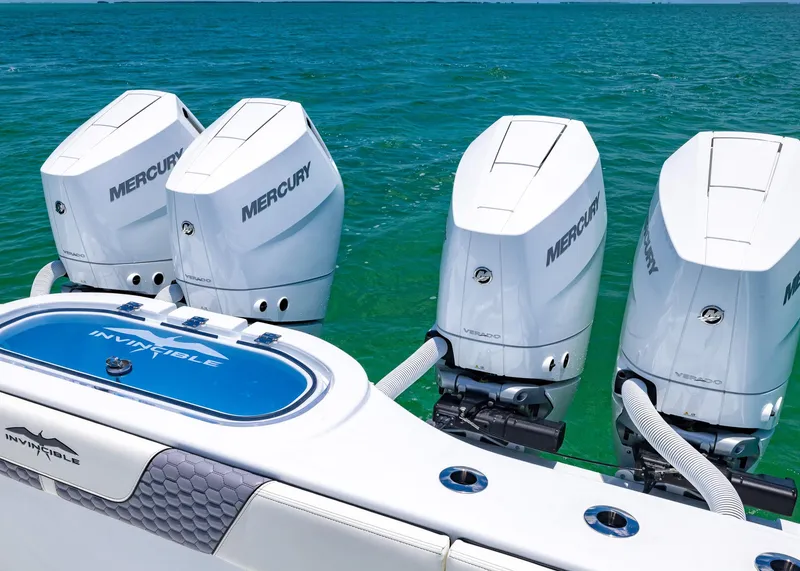 Slide: The Image of 2026 Invincible 38 Catamaran with four Mercury outboard engines on turquoise water. - 39