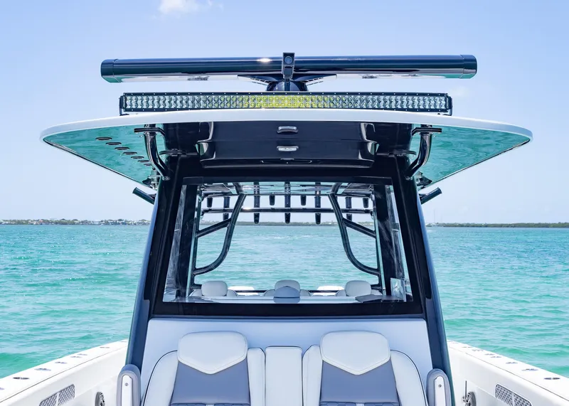 Slide: The Image of 2026 Invincible 38 Catamaran on clear blue water, showcasing sleek design and modern features. - 8