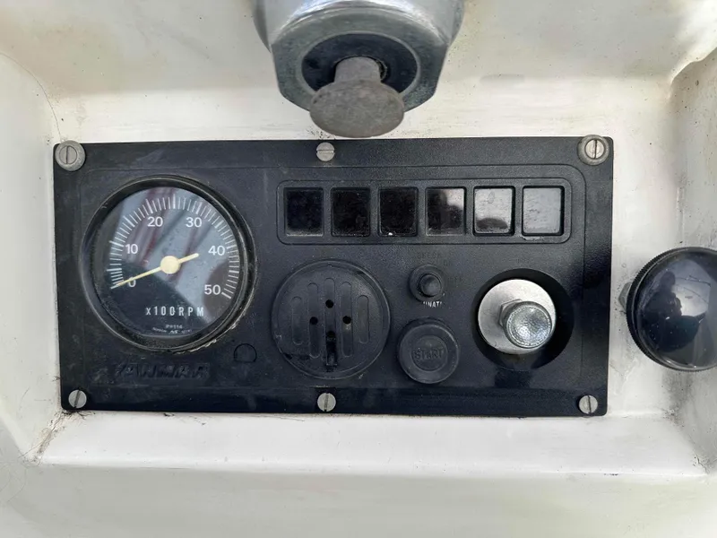 Slide: The Image of Control panel of a 1983 Racing Sloop sailboat with RPM gauge and ignition switch. - 6