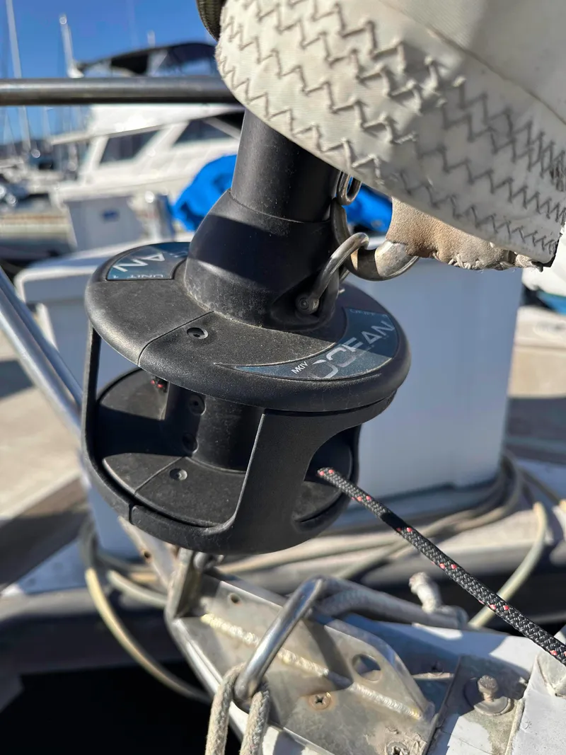 Slide: The Image of Close-up of a 1983 Racing Sloop sailboat's rigging mechanism at a marina. - 7