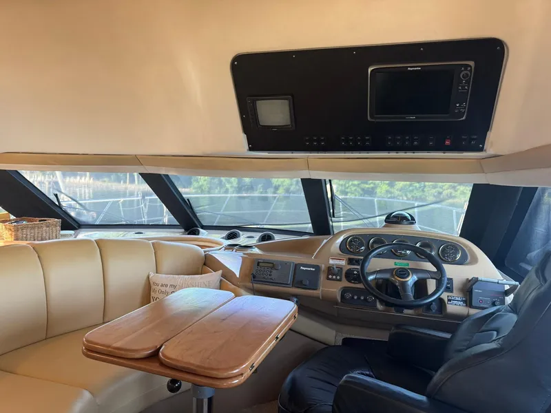 Slide: The Image of Interior of 2001 Carver 450 Voyager Pilothouse with helm and seating area. - 26