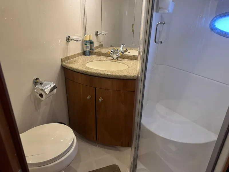 Slide: The Image of Bathroom interior of 2001 Carver 450 Voyager Pilothouse with sink, toilet, and shower. - 36