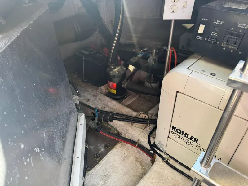 Slide: The Image of Engine room of 2001 Carver 450 Voyager Pilothouse with Kohler power system. - 45