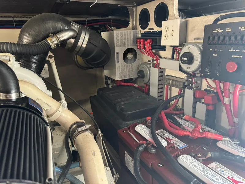 Slide: The Image of Engine room of 2001 Carver 450 Voyager Pilothouse with batteries and electrical components. - 47