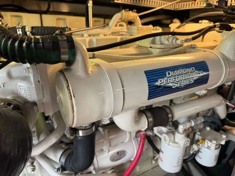 Slide: The Image of Engine of 2001 Carver 450 Voyager Pilothouse, Diamond Performance Series label visible. - 49