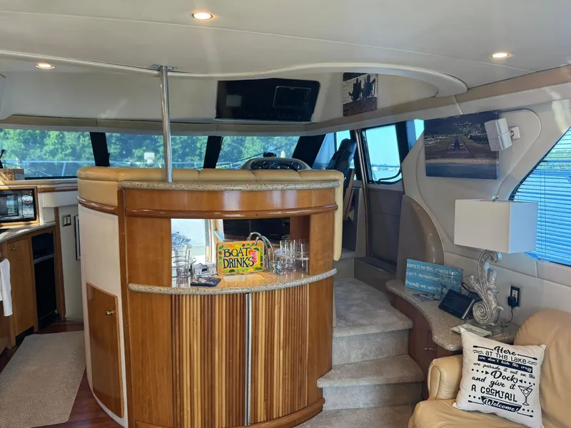 Slide: The Image of Interior of 2001 Carver 450 Voyager Pilothouse with bar and cozy seating area. - 17
