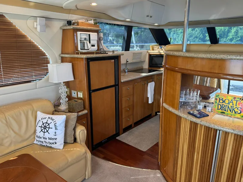 Slide: The Image of Luxurious interior of 2001 Carver 450 Voyager Pilothouse with kitchen and seating area. - 18