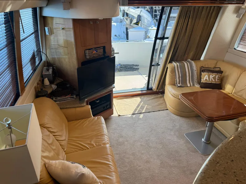 Slide: The Image of Luxurious interior of 2001 Carver 450 Voyager Pilothouse with leather seating and a TV. - 19