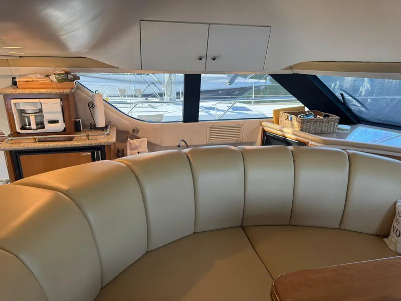 Slide: The Image of Interior of 2001 Carver 450 Voyager Pilothouse with leather seating and kitchenette. - 28
