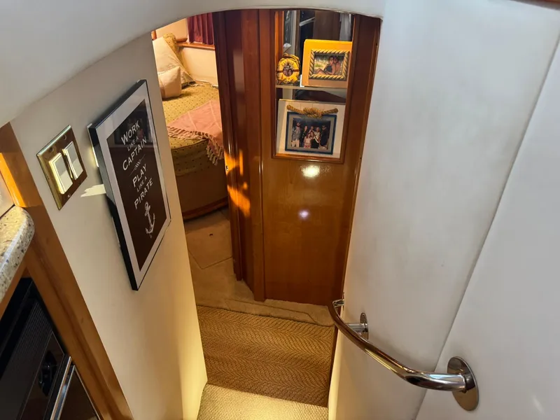 Slide: The Image of Interior of 2001 Carver 450 Voyager Pilothouse with cozy bedroom and decorative wall art. - 33